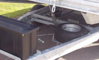 Trailer tilted with spare wheel and optional strap box